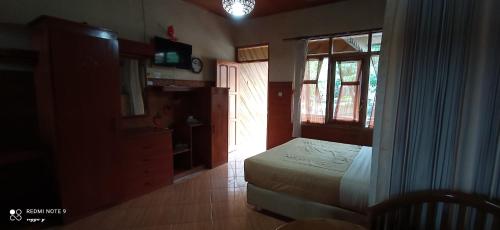 Imagen de la habitación del Bungalow kampoengstrawberry ciwidey. Foto 15