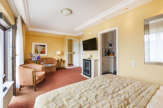 Imagen de la habitación del B&uuml;ngers Apartment-Hotel mit Gartensauna - modern, gem&uuml;tlich und strandnah. Foto 4