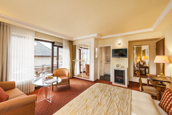 Imagen de la habitación del B&uuml;ngers Apartment-Hotel mit Gartensauna - modern, gem&uuml;tlich und strandnah. Foto 9