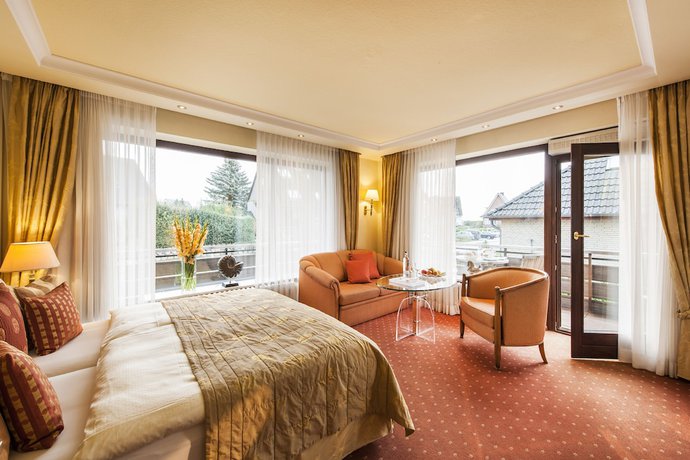 Imagen de la habitación del B&uuml;ngers Apartment-Hotel mit Gartensauna - modern, gem&uuml;tlich und strandnah. Foto 10