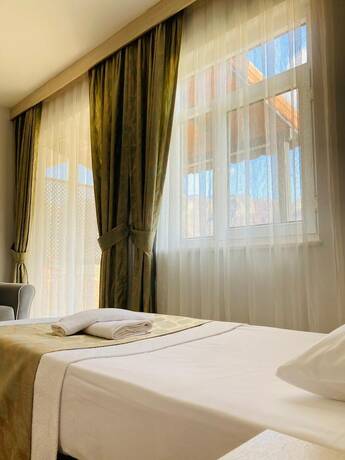 Imagen de la habitación del Bybassios Hotel. Foto 19