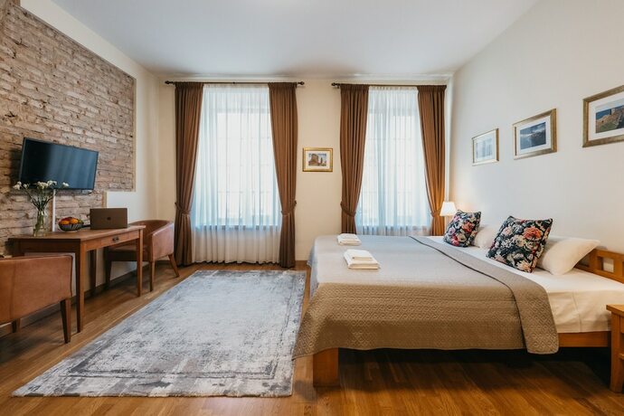 Imagen de la habitación del CATHEDRAL Old Town Suites. Foto 13