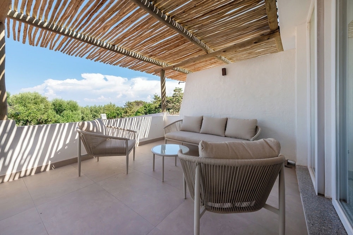 Imagen de la habitación del Cala Lupo Resort. Foto 11