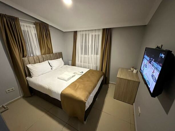 Imagen de la habitación del Camellia Suit Hotel. Foto 9