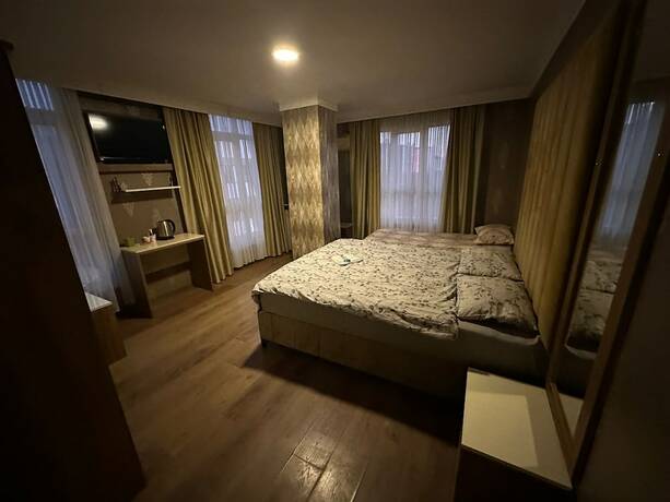 Imagen de la habitación del Camellia Suit Hotel. Foto 11