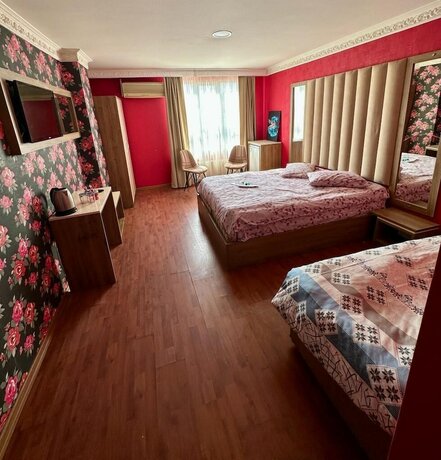 Imagen de la habitación del Camellia Suit Hotel. Foto 12