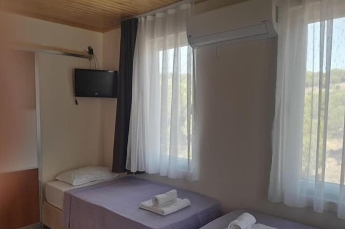 Imagen de la habitación del Camlaralti Pansiyon. Foto 8