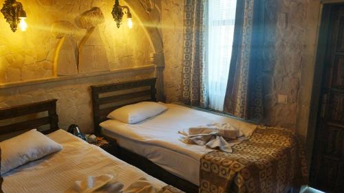 Imagen de la habitación del Cappadocia Caves Hotel, Goreme. Foto 10