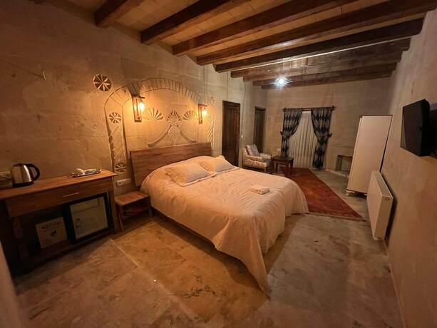 Imagen de la habitación del Cappadocia Tuğhan Stone House. Foto 16