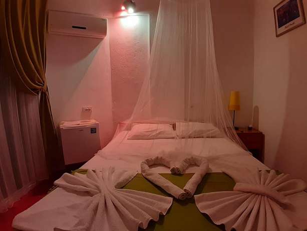 Imagen de la habitación del Caretta Caretta Hotel. Foto 14