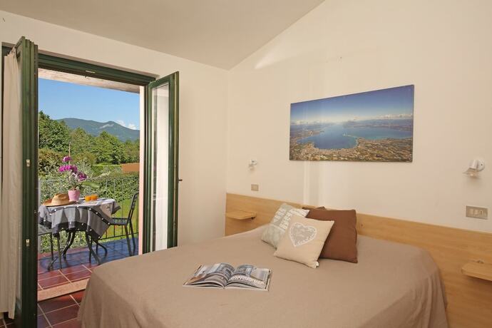 Imagen de la habitación del Casa per Ferie Garda Il Melograno. Foto 11