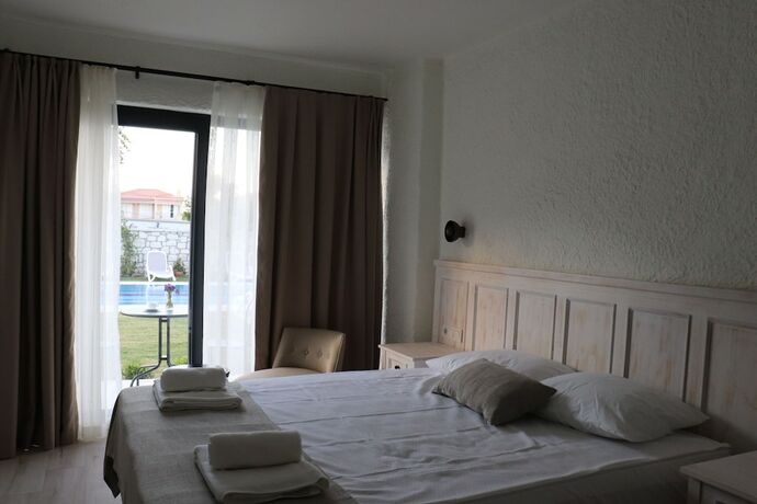 Imagen de la habitación del Cemal Alacati Butik Hotel. Foto 16