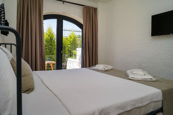 Imagen de la habitación del Cemal Alacati Butik Hotel. Foto 19