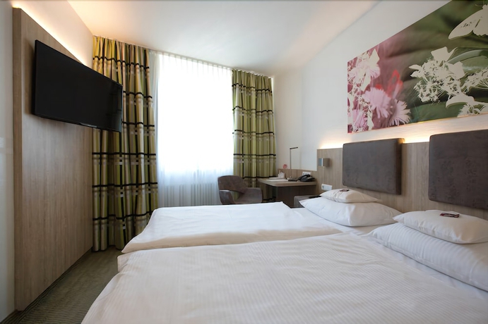Imagen de la habitación del Central Hotel Eschborn. Foto 5