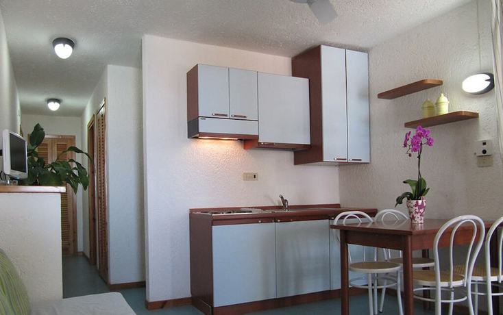 Imagen de la habitación del Centro Vacanze Cugnana Verde. Foto 11