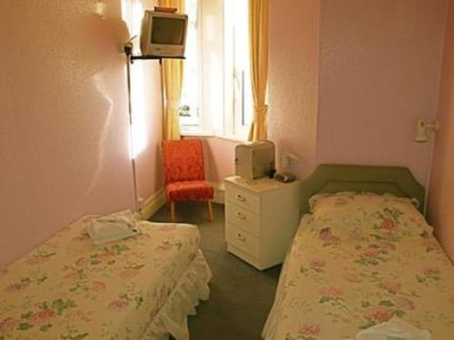 Imagen de la habitación del Cherry Tree Hotel. Foto 7