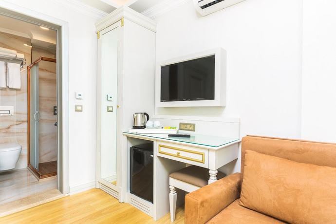 Imagen de la habitación del City Hall Hotel. Foto 8