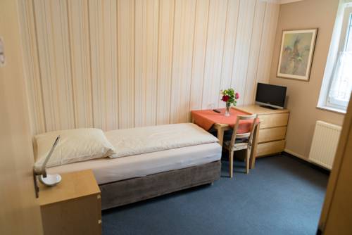 Imagen de la habitación del City Hotel Hilden. Foto 16