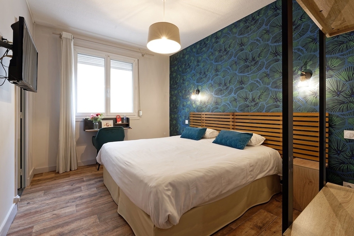 Imagen de la habitación del Contact H&ocirc;tel du Commerce et son restaurant C&ocirc;te &agrave; C&ocirc;te. Foto 2