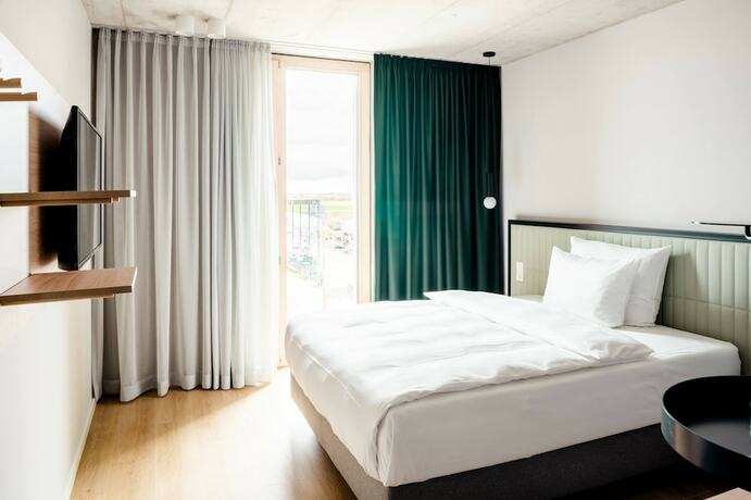 Imagen de la habitación del Coreum Hotel. Foto 17