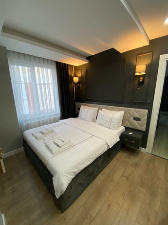 Imagen de la habitación del Cosy Suite Hotel. Foto 16