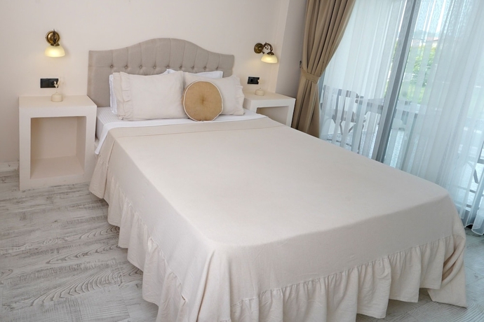 Imagen de la habitación del Cunda House Kucuk Otel. Foto 10