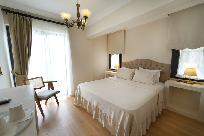 Imagen de la habitación del Cunda House Kucuk Otel. Foto 11