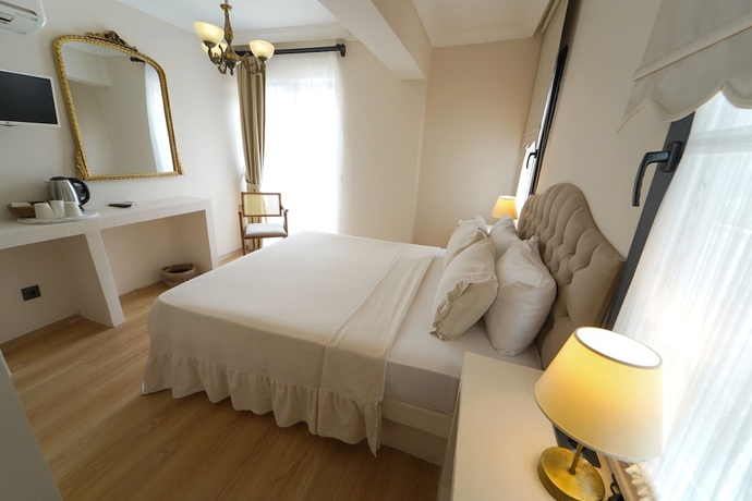 Imagen de la habitación del Cunda House Kucuk Otel. Foto 12