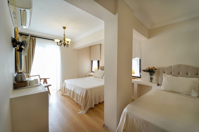Imagen de la habitación del Cunda House Kucuk Otel. Foto 13