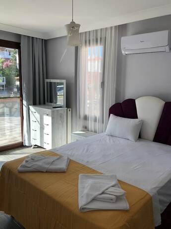 Imagen de la habitación del Cunda Limon Otel. Foto 17
