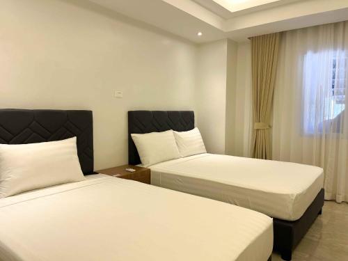 Imagen de la habitación del D\' Elmer\'s Place Hotel. Foto 17