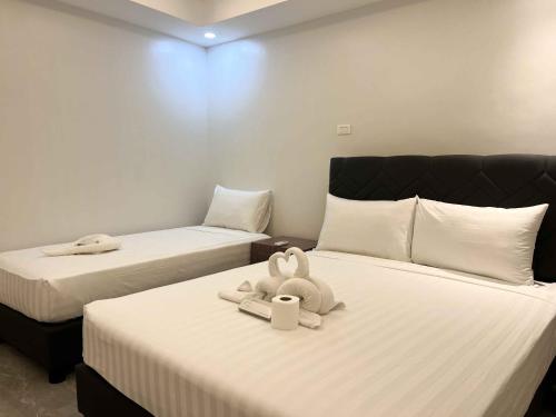 Imagen de la habitación del D\' Elmer\'s Place Hotel. Foto 19