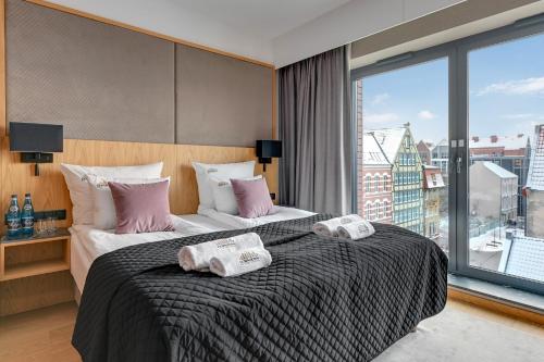 Imagen de la habitación del DEO PLAZA Suites & Riverside by Downtown Apartments. Foto 17