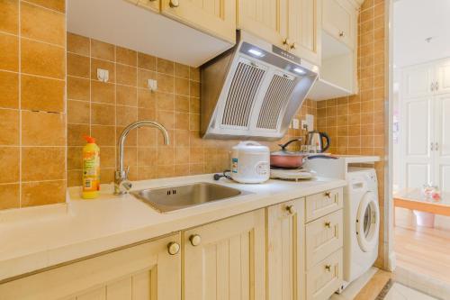 Imagen de la habitación del Dalian Aegean Sea Apartment. Foto 8