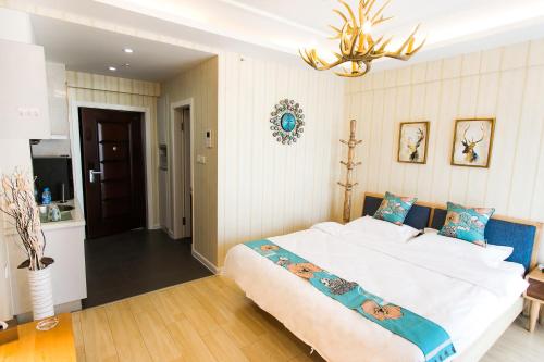 Imagen de la habitación del Dalian Bo Ke Business Apartment. Foto 9
