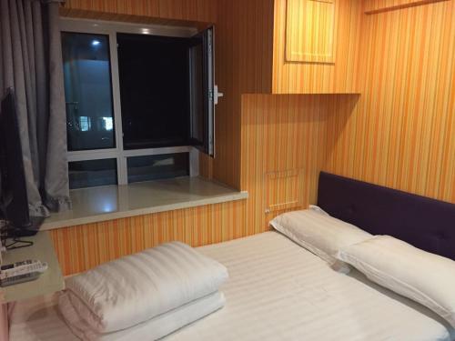 Imagen de la habitación del Dalian Sweet Home Inn. Foto 7