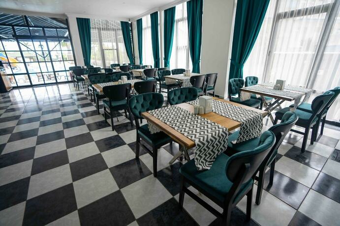 Imagen del bar/restaurante del De Mare Family Hotel. Foto 9