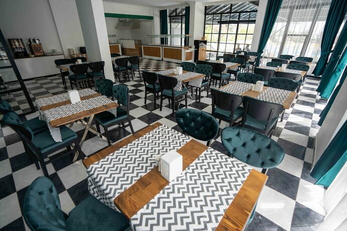 Imagen del bar/restaurante del De Mare Family Hotel. Foto 10