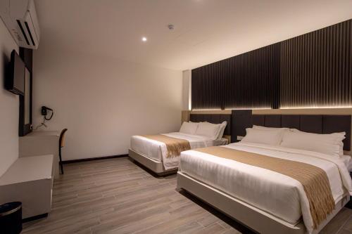 Imagen de la habitación del De Quinton Hotel. Foto 14