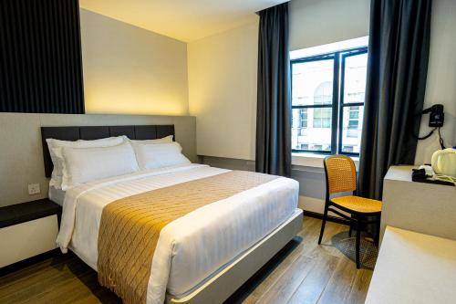 Imagen de la habitación del De Quinton Hotel. Foto 16