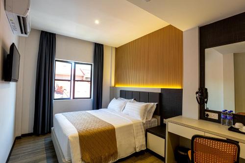 Imagen de la habitación del De Quinton Hotel. Foto 20