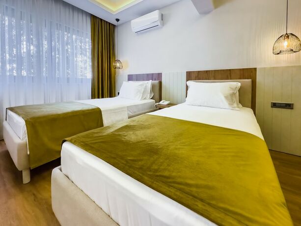 Imagen de la habitación del Dedeoğlu Port Hotel. Foto 13