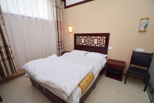 Imagen de la habitación del Dengfeng Shaolin Tourist Resort. Foto 8