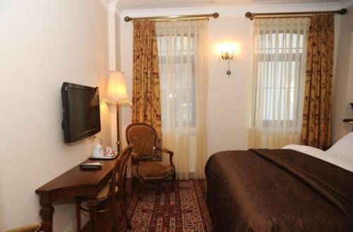 Imagen de la habitación del Dila Suites. Foto 41