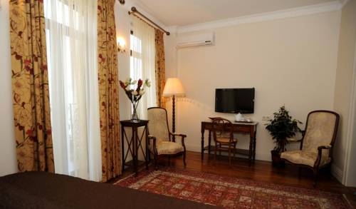 Imagen de la habitación del Dila Suites. Foto 42