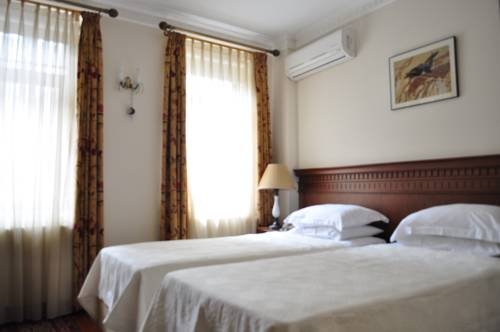 Imagen de la habitación del Dila Suites. Foto 46