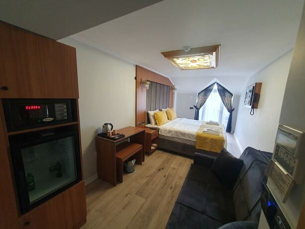Imagen de la habitación del Dimora Gold Hotel. Foto 13