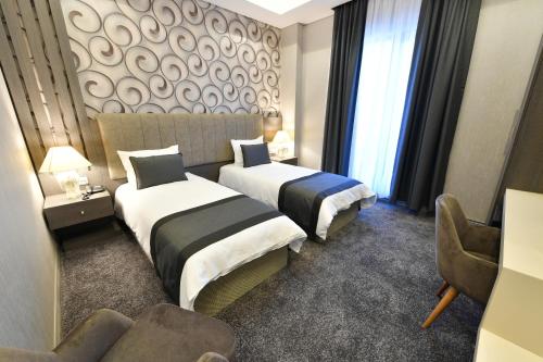 Imagen de la habitación del D'lux Boutique Hotel. Foto 7
