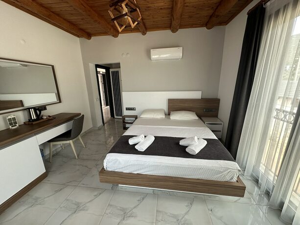Imagen de la habitación del Doganin Ruhu Hotel and Bungalow. Foto 13