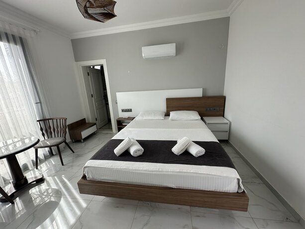 Imagen de la habitación del Doganin Ruhu Hotel and Bungalow. Foto 19